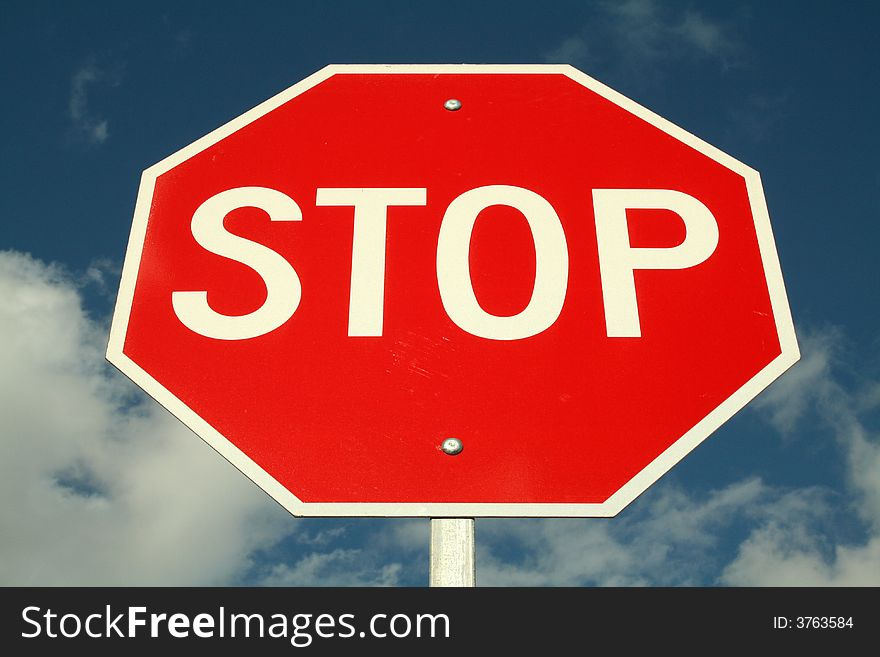 Imposing Stop Sign against Blue Sky