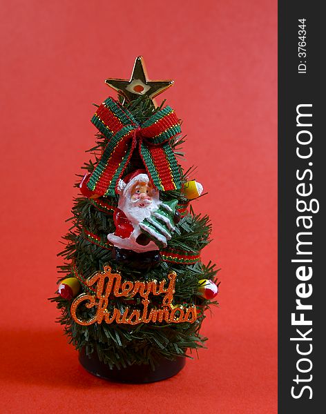 A small christmas tree ornamment. A small christmas tree ornamment.