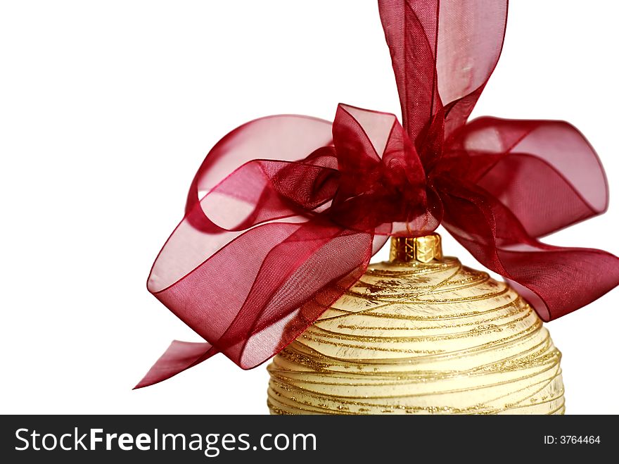 Christmas ornament - golden christmas ball with red ribbon and bow