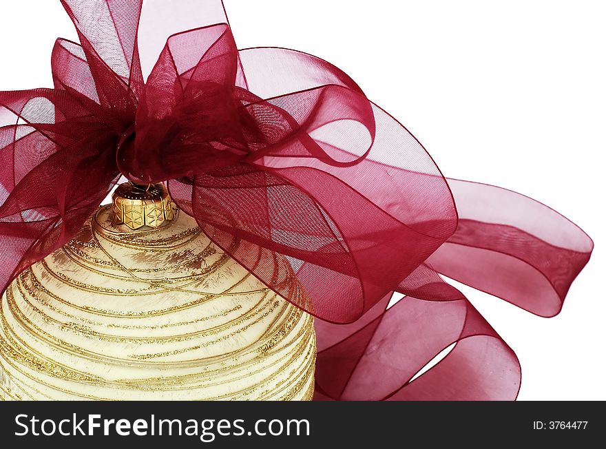 Christmas ornament - golden christmas ball with red ribbon and bow