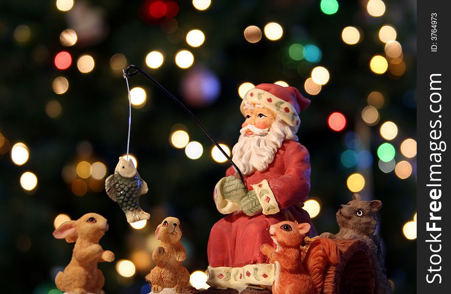 Santa Claus and his woodland friends go fishing on Christmas Eve with multicolored lights dancing off the forest trees. Santa Claus and his woodland friends go fishing on Christmas Eve with multicolored lights dancing off the forest trees