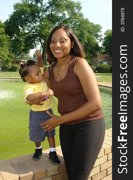 A picture of a happy mother and child with outdoor background