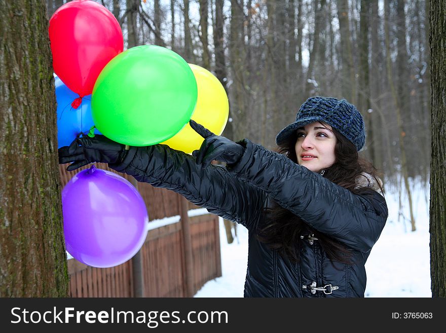 A girl pointind on the  ballon. A girl pointind on the  ballon
