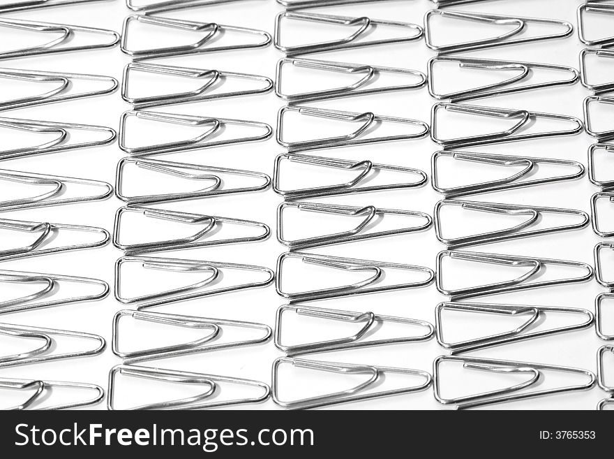Background of small metal paper clips