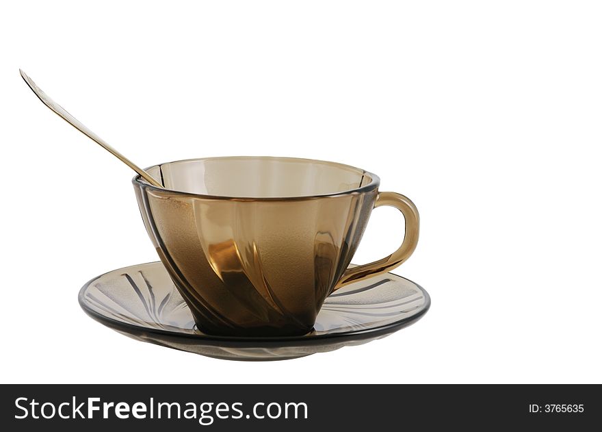 Glass tea or coffee cup with spoon