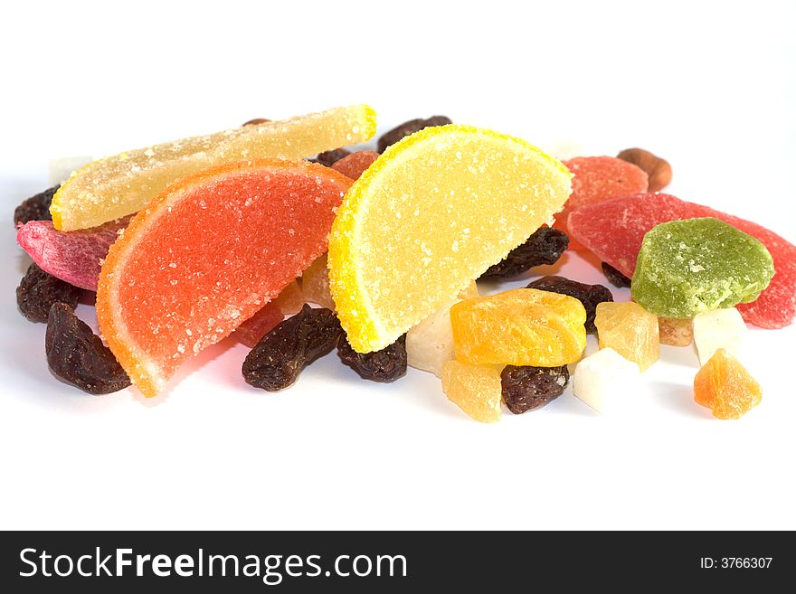Dried fruits, raisins, candies and nuts on white backgroud. Dried fruits, raisins, candies and nuts on white backgroud