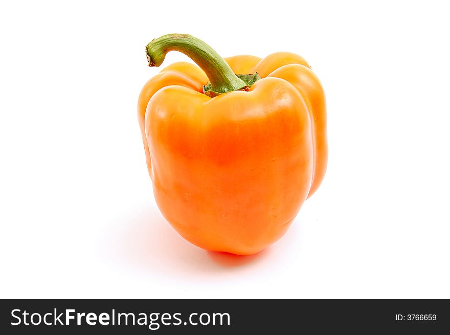 Untypical orange paprika (pepper) isolated on white background