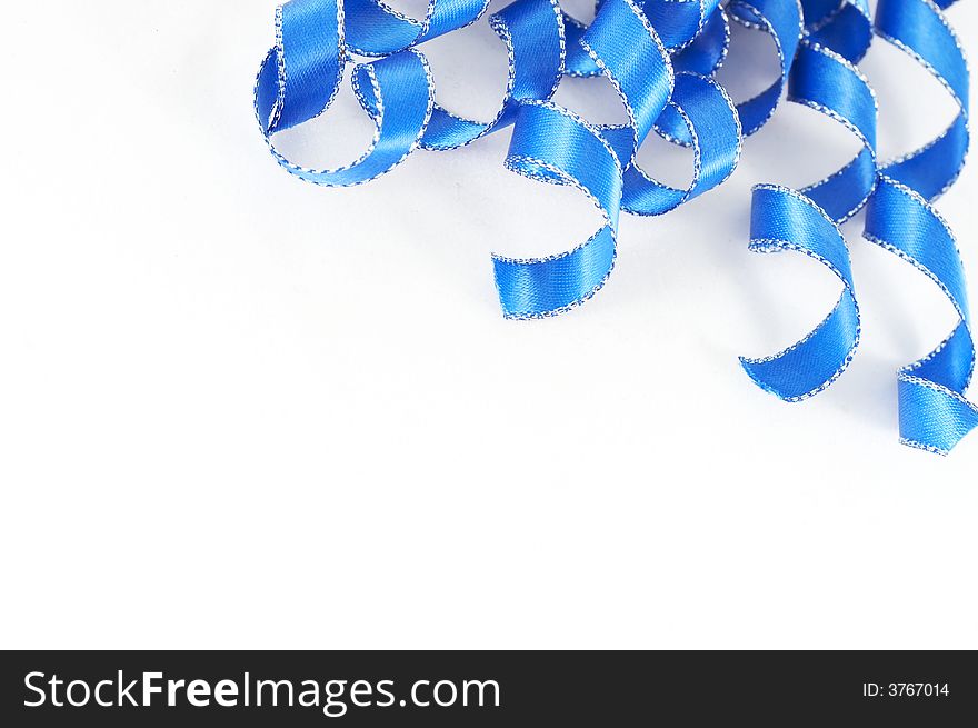 Macro of blue ribbon on white background. Macro of blue ribbon on white background