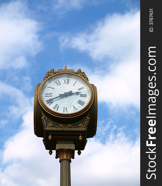Large clock against blue sky. Large clock against blue sky