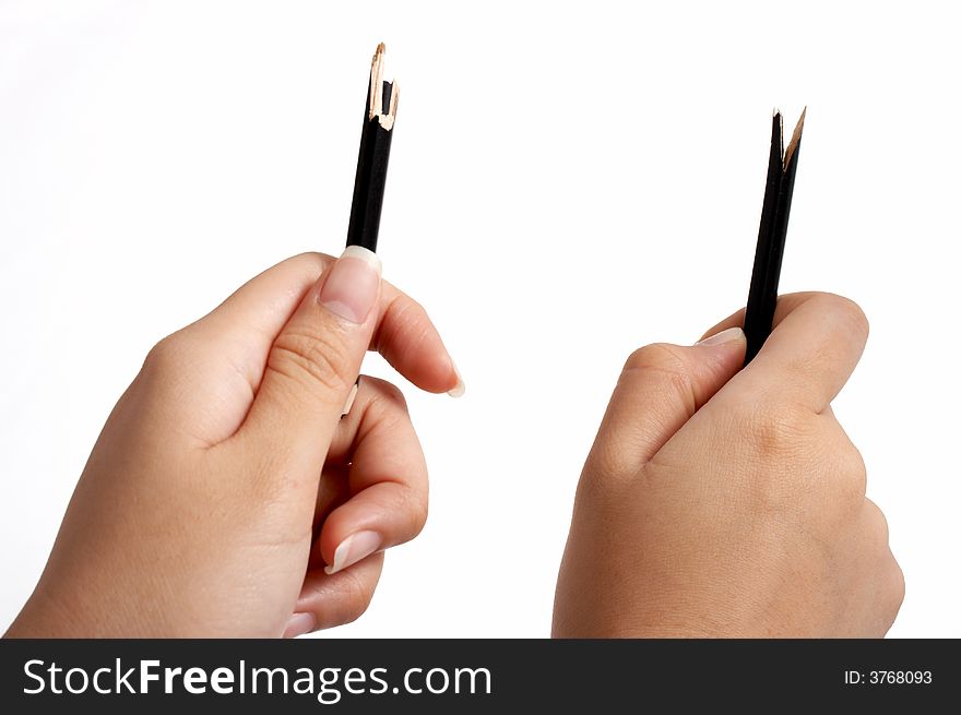 Hands trying to break a pencil over a white background. Hands trying to break a pencil over a white background