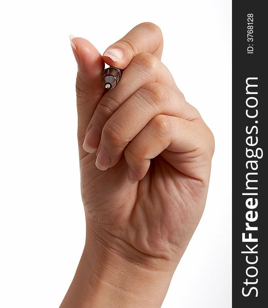 A hand holding a pen over a white background