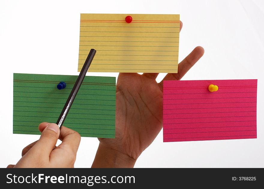 Three blank cards pinned on a hand