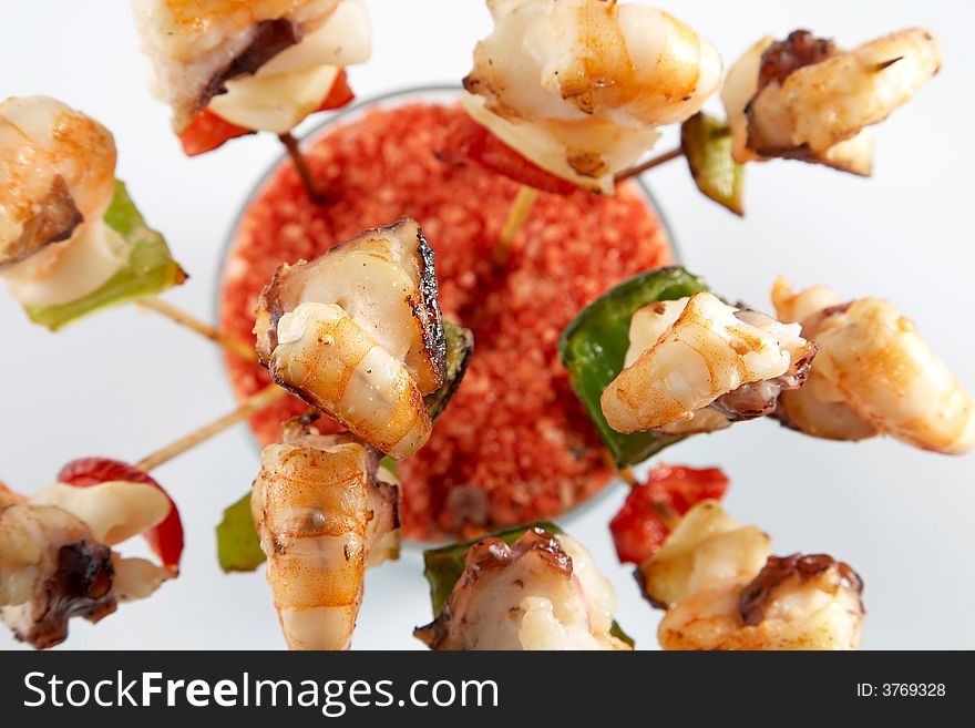 Skewer of prawns and roast vegetables