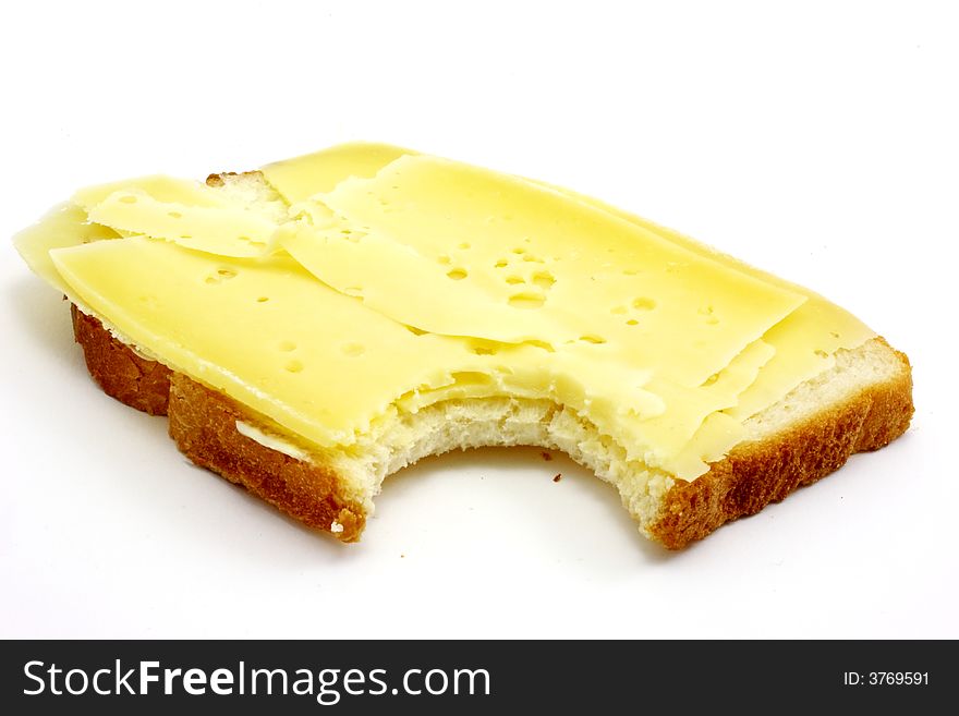 Slice of white bread with dutch cheese isolated on white