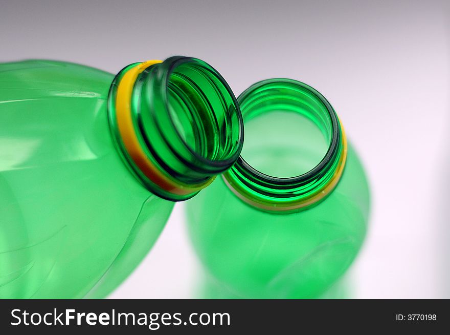 Plastic bottles, shallow DOF, focus on the top of the bottle