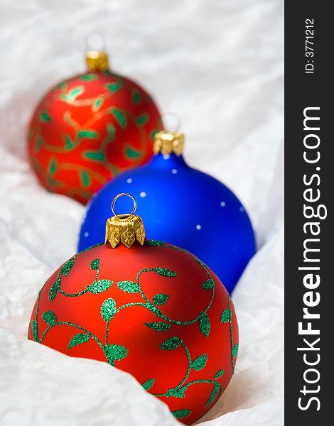 Christmas balls in wrapping paper, close-up