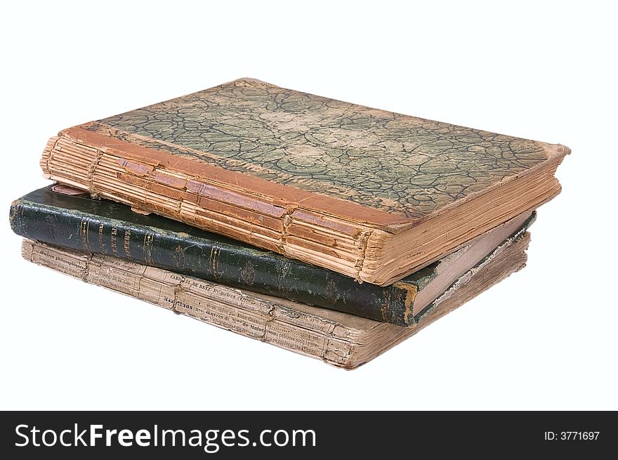 Pile from three ancient books. Isolated on white background.