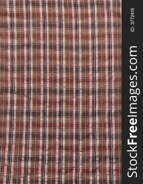 A neutral brown plaid cloth, suitable for a background texture.