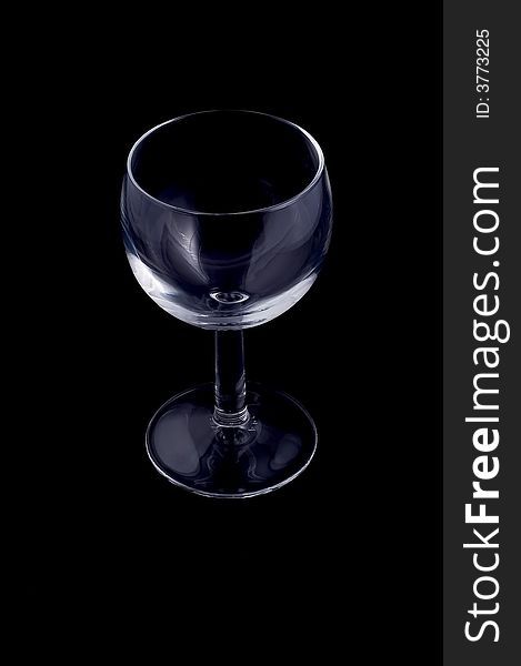 Small wineglass on black background