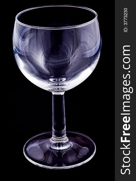 Empty wineglass on black background