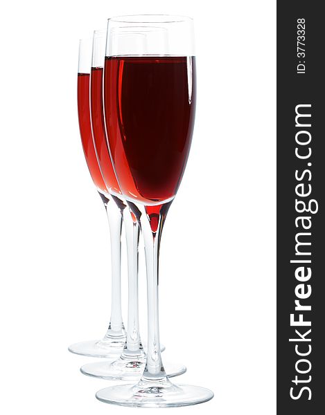 Three high and beautiful glasses with red wine