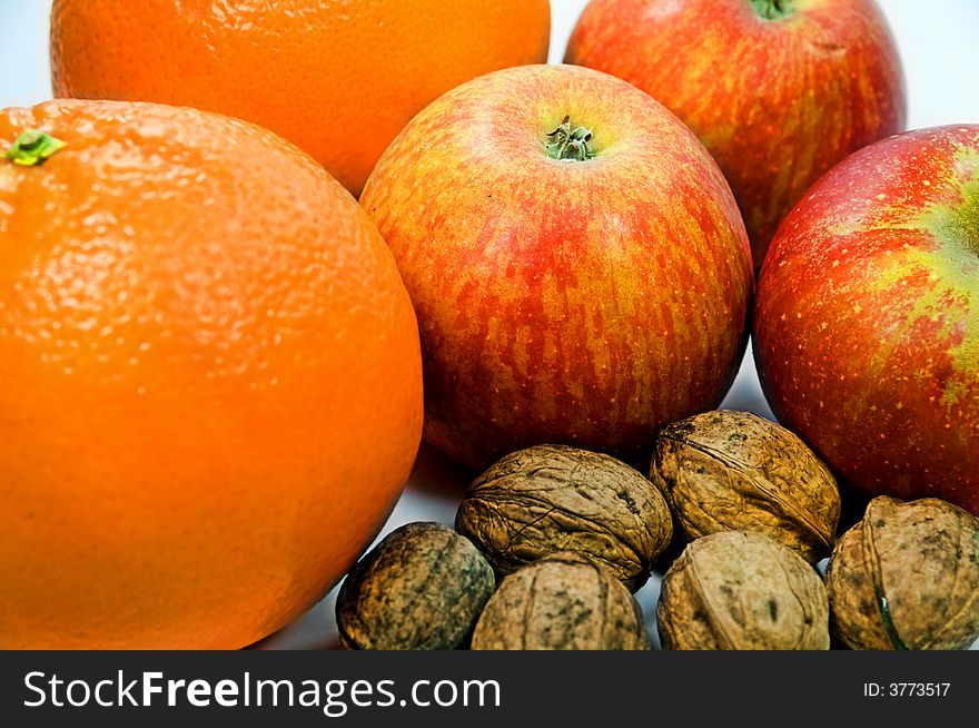 Apples, Walnuts and Oranges on white background