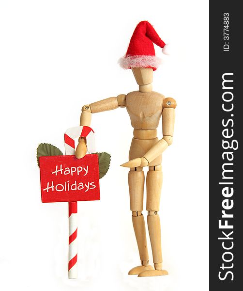 Wooden figurine holding Happy Holiday sign. Wooden figurine holding Happy Holiday sign.