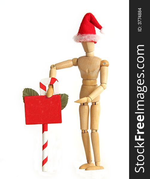 Wooden figurine holding holiday announcement sign. Wooden figurine holding holiday announcement sign.