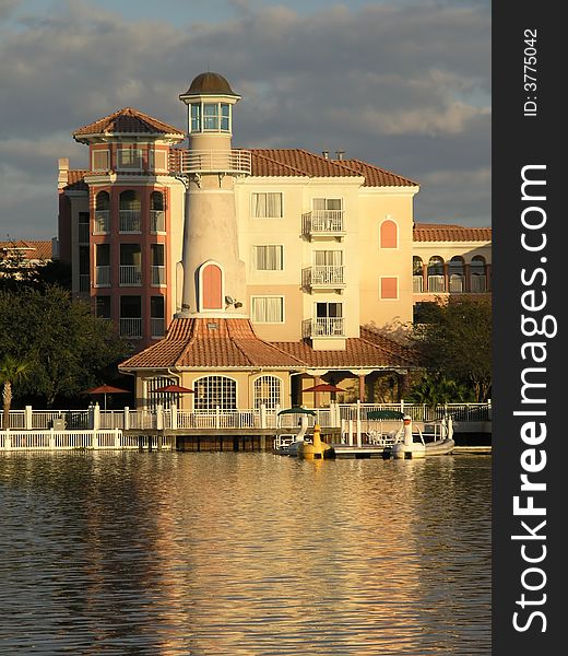 Vacation Resort Buildings Lighthouse and Lake Sunset. Vacation Resort Buildings Lighthouse and Lake Sunset