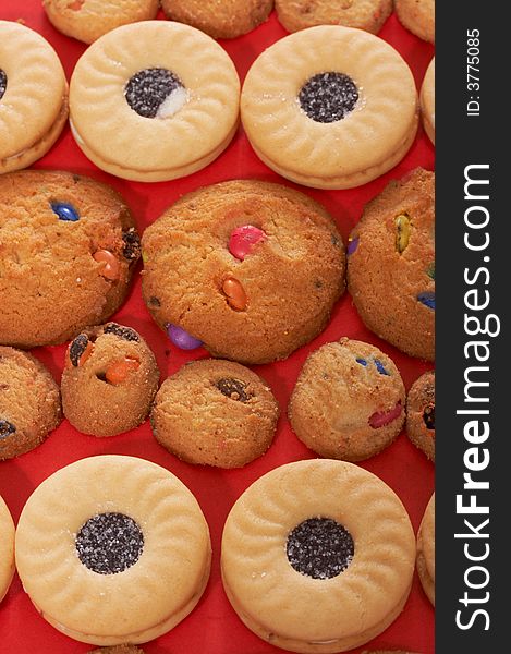 Different variety of cookies over a red background. Different variety of cookies over a red background