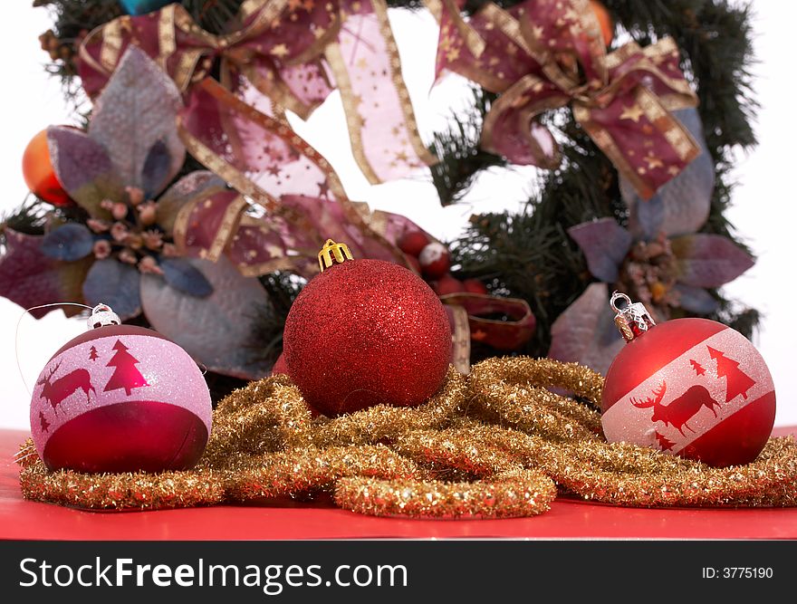 Variety of Christmas decorations over a red and white background