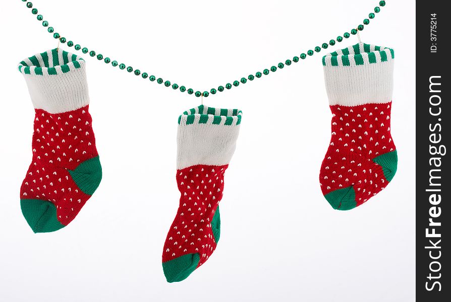 Christmas stockings hanging over a white background