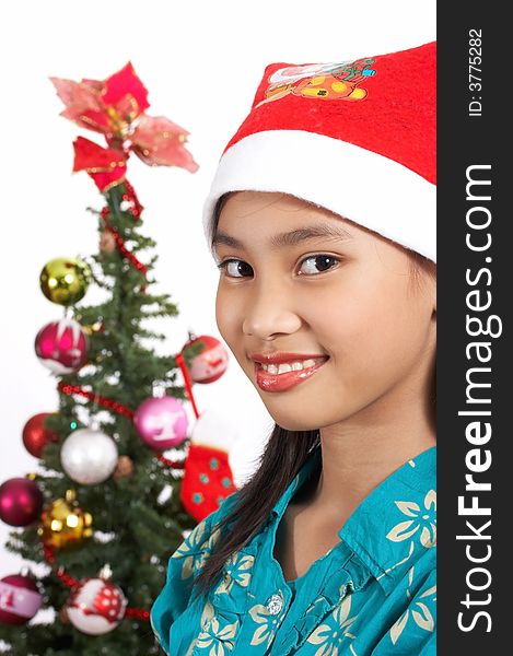 A happy girl wearing a santa hat