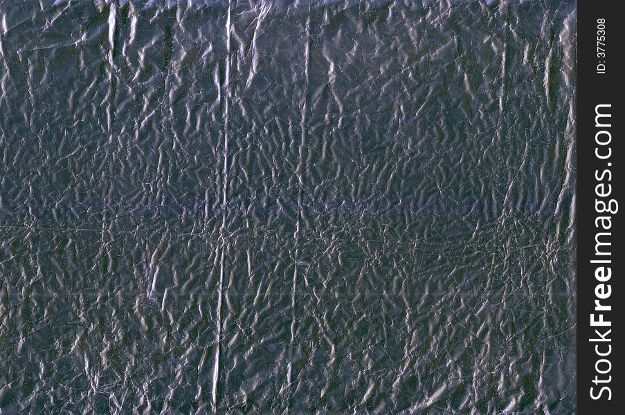 A flattened piece of silver wrapping foil, suitable as a background texture.