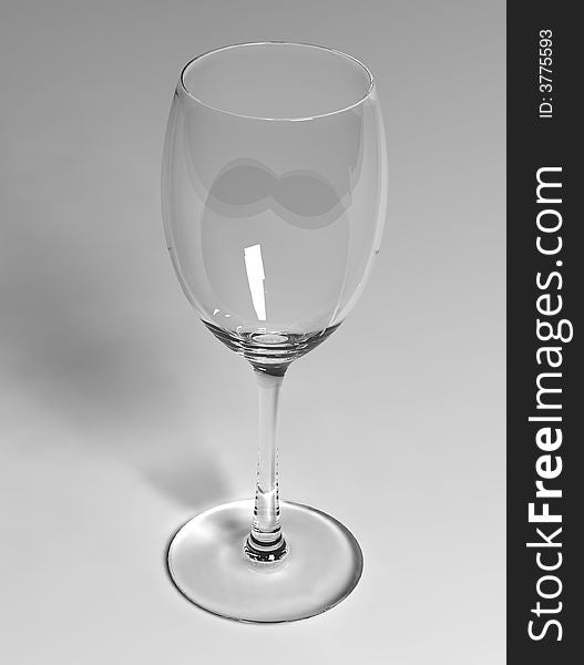 Empty white wineglass on white background