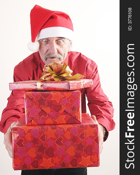 Businessman with Christmas gift and Santa Claus hat. Businessman with Christmas gift and Santa Claus hat.