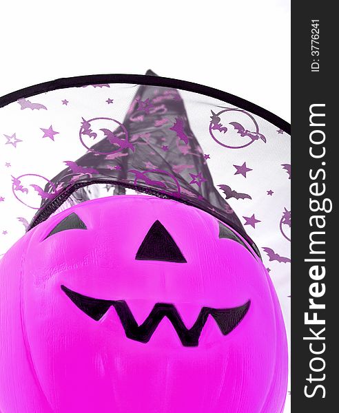 Jack o lantern wearing a witch hat over a white background. Jack o lantern wearing a witch hat over a white background
