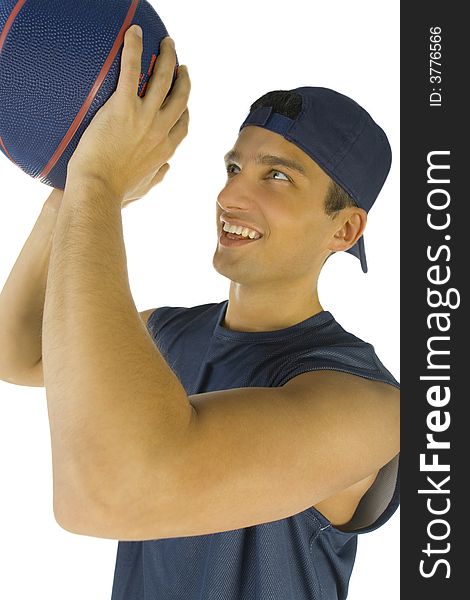 Young, happy man preparing to throw basketball. White background.