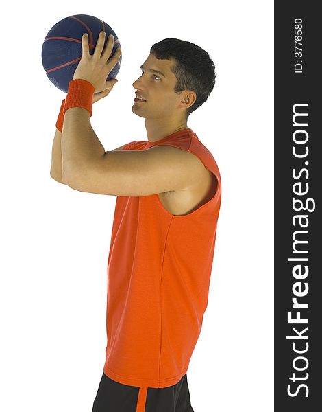 Young man preparing to throw basketball. White background, side view. Young man preparing to throw basketball. White background, side view.