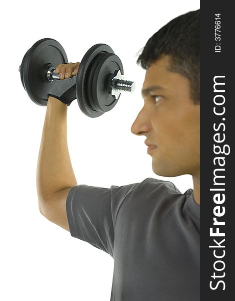 Young man exercising arm muscles with dumbbell. White background. Young man exercising arm muscles with dumbbell. White background.