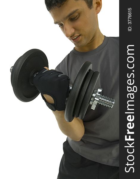 Young man exercising arms muscles with dumbbell. White background, front view. Young man exercising arms muscles with dumbbell. White background, front view.