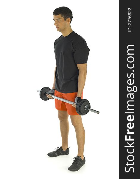 Young man exercising arms muscles with barbell. Isolated on white background. Side view. Young man exercising arms muscles with barbell. Isolated on white background. Side view.