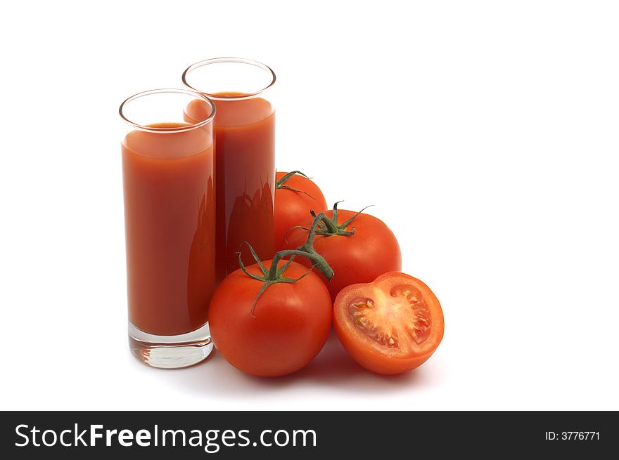 Fresh tomatoes and juice on white background