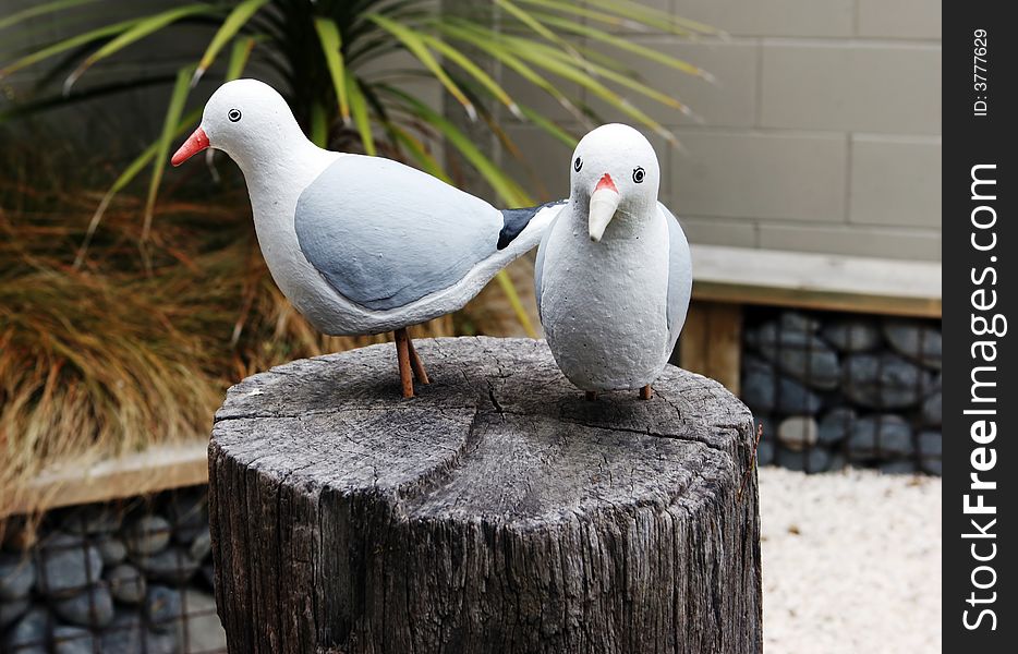 Bird statues on a wooden block. Bird statues on a wooden block.