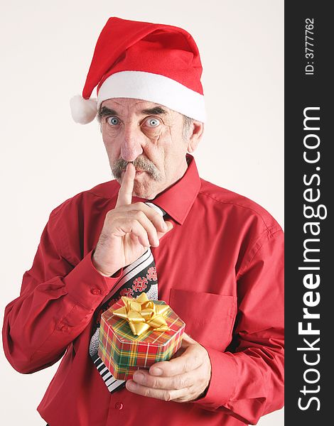 Businessman with Christmas gift and Santa Claus hat. Businessman with Christmas gift and Santa Claus hat.