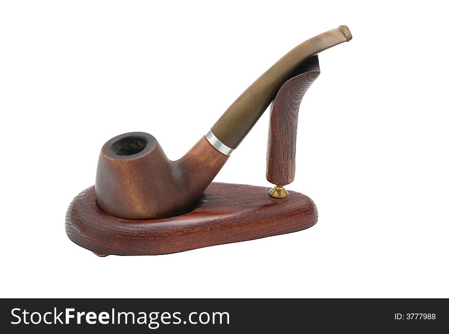 Old brown cherry pipe stay on the support. Old brown cherry pipe stay on the support