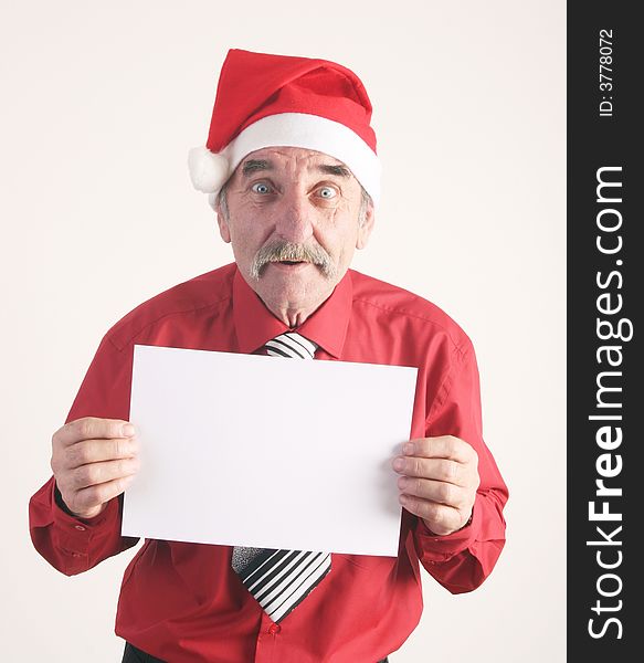 Businessman with blank sign and Santa Claus hat. Businessman with blank sign and Santa Claus hat.