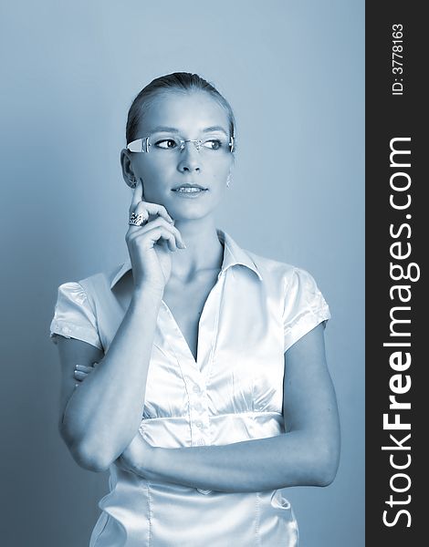 Business portrait of a young thinking and successful woman. Business portrait of a young thinking and successful woman