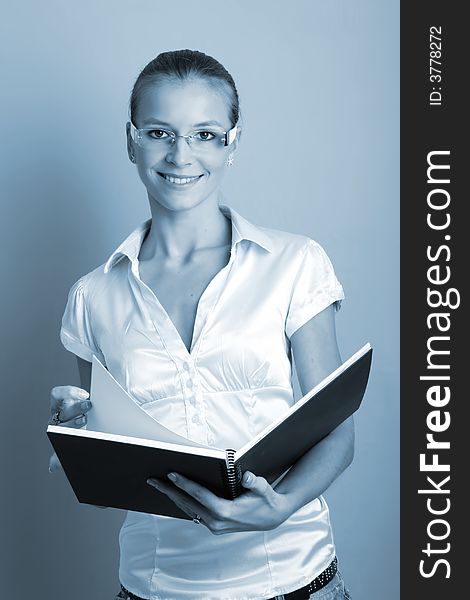 Business portrait of a young and successful woman with a folder. Business portrait of a young and successful woman with a folder