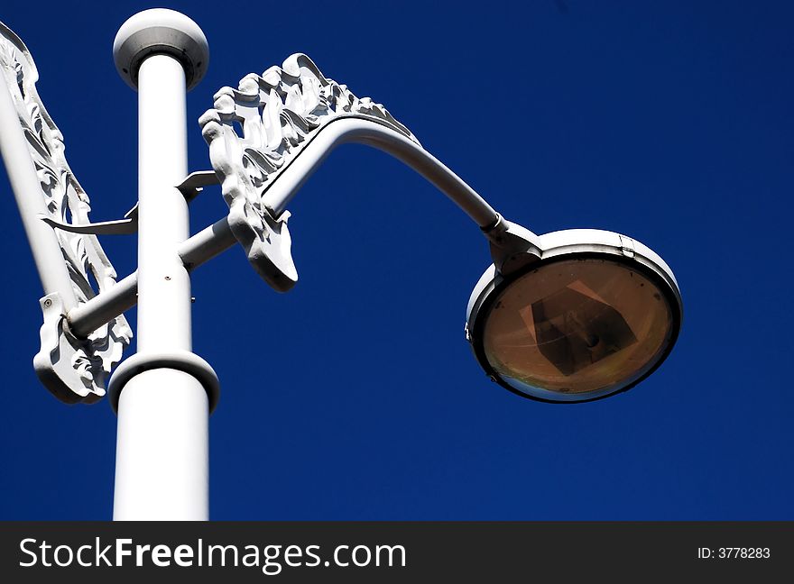 Old Fashioned Lamp on the blue sky background